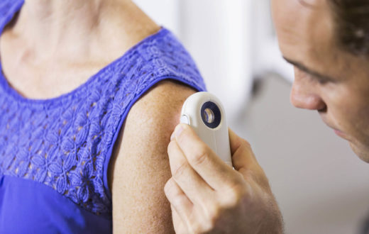Doctor examining a patients skin