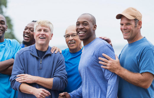 A group of men in blue shirts