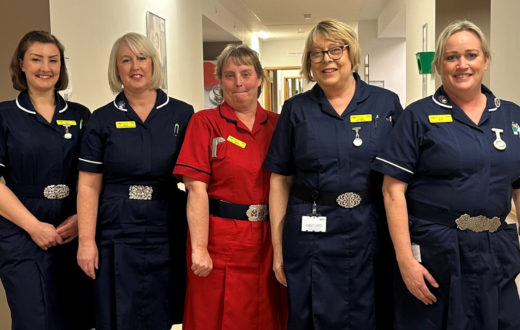 Nurses at KIMS Hospital for International Nurses' Day showing off their Nurses buckles