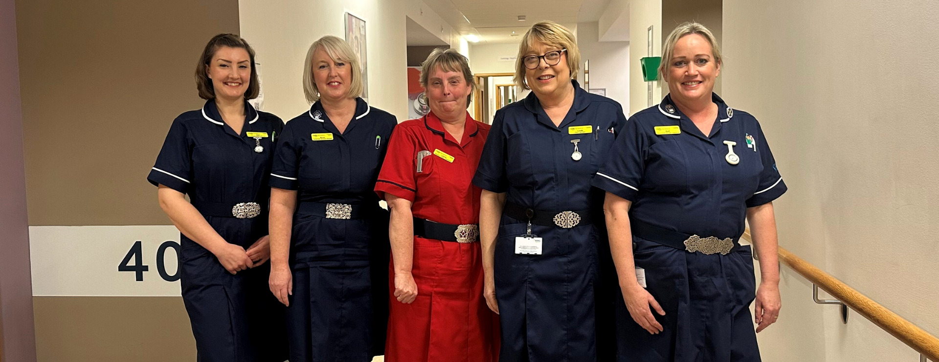 Nurses at KIMS Hospital for International Nurses' Day showing off their Nurses buckles