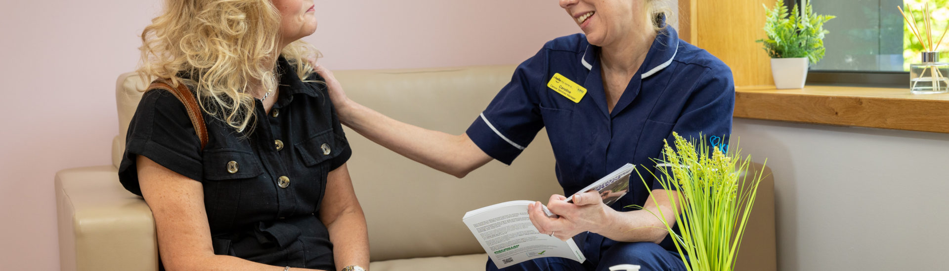 A patient being comforted by a Nurse