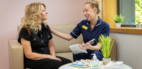 A patient being comforted by a Nurse