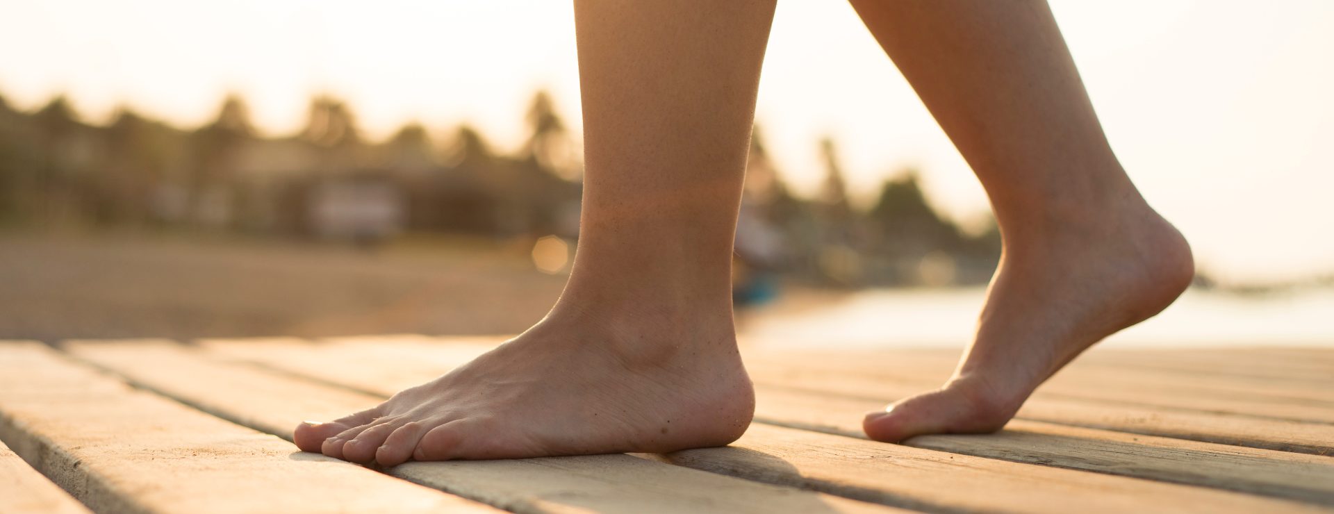 Person walking along the beach bare feet