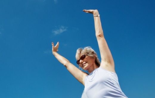 Lady enjoying her summer holiday, using our summer health hacks to improve her overall health.