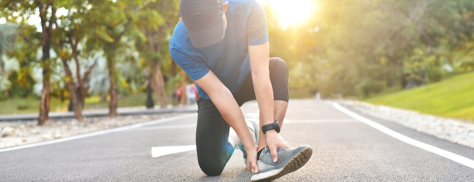 man experiencing foot pain while on a run