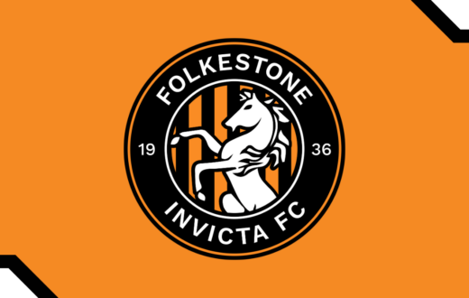 Folkestone Invicta FC circular club crest featuring a white horse on an orange and black striped background.