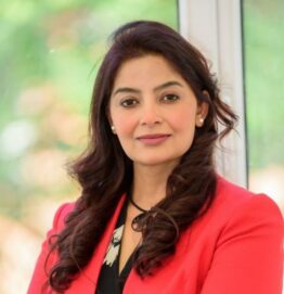Dr. Vimple Bhalani, an experienced multilingual Private GP in the UK, smiling in a professional medical headshot.
