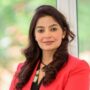 Dr. Vimple Bhalani, an experienced multilingual Private GP in the UK, smiling in a professional medical headshot.
