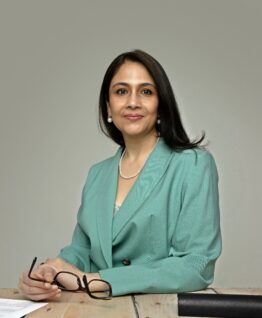 Dr. Seshadri, a Senior Consultant Gynaecologist and UK fertility specialist, smiling in a professional portrait.