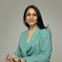Dr. Seshadri, a Senior Consultant Gynaecologist and UK fertility specialist, smiling in a professional portrait.