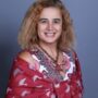 Professional photo of Miss Nataly Atalla, a smiling Gynaecologist specializing in infertility and menopause care.