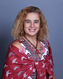 Professional photo of Miss Nataly Atalla, a smiling Gynaecologist specializing in infertility and menopause care.